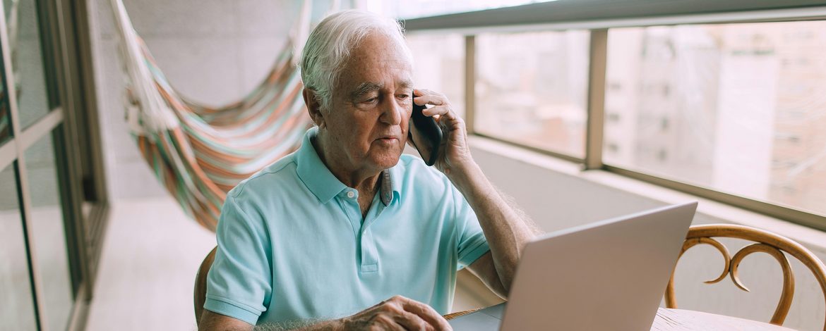 older person in front of laptop